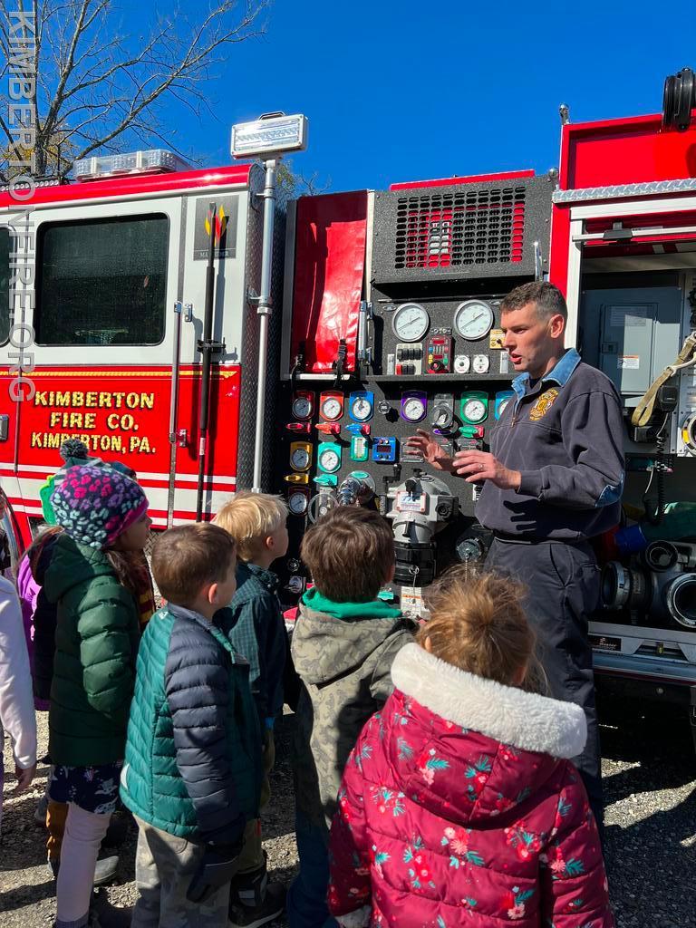 Rob Koren talks with the kids next to the fire truck
