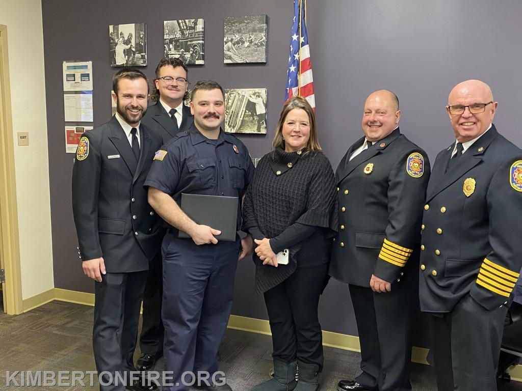 L-R:  Lieutenant Tyler Bauer, Rob Galvin, Louis Flora and his mother, Assistant Chief Doug Gable and Chief Jay Pollinger.